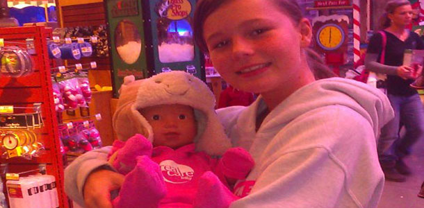 Lexi Evans and her computerized baby at Bass Pro Shops.