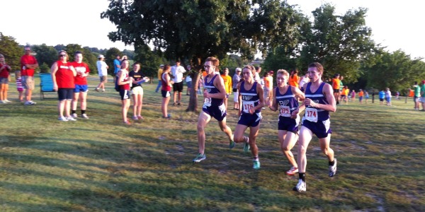 Boys varsity runners Ethan Heartzel, Joe Pierce, George Letner, and Dakota Helm prepare to cross the finish line at Anderson County.