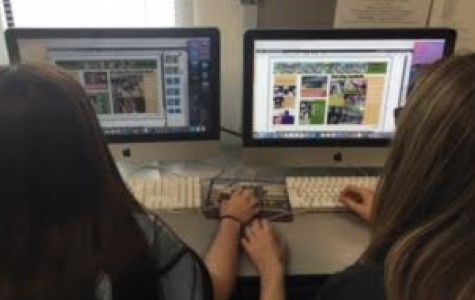 Sophomore Cheyanne Daniels and Freshman Carly Lindenmeyer working hard on the yearbook.