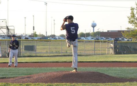 Senior Adam Carlson pitching for the Baldwin Bulldogs during high school season.