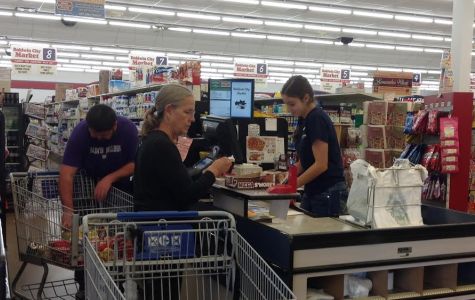 Baldwin City Market cashier Caitlin Countryman is hard at work checking out customers right after school.
