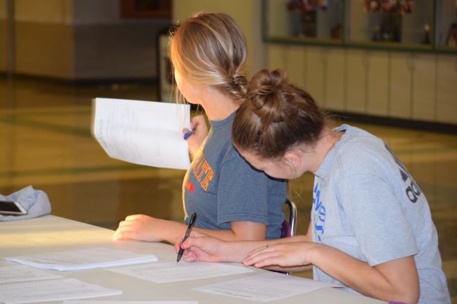 Junior Kat Stan and Sophomore Cameryn Petterson running the ballot table at the BIT on Oct. 14.