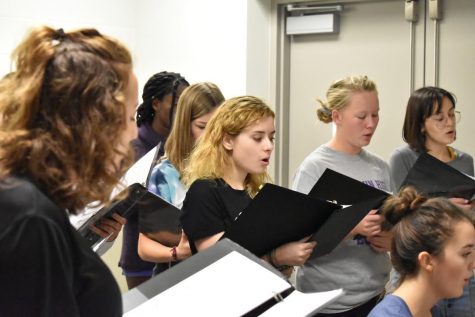 The concert choir working hard to prepare for the fall concert.