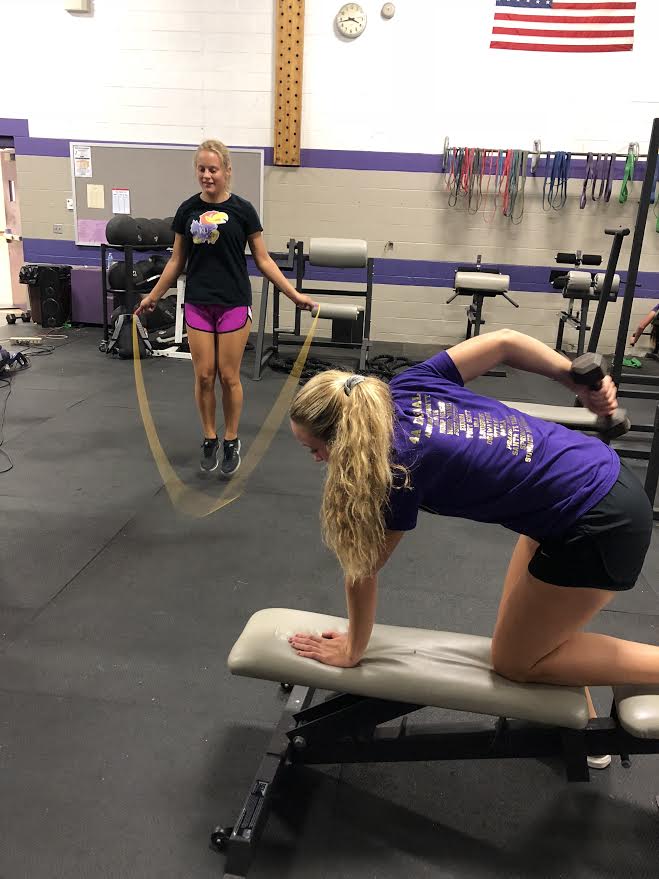 Sisters Cambria and Tavia Crowe work out every day after school in the weight room with the basketball team 