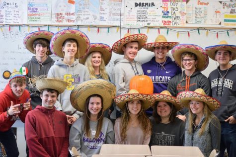 Spanish teacher Katie Marten (third from left on top row) was chosen as the September Staff of the Month. Previous award winner Kathy Cook nominated Marten.