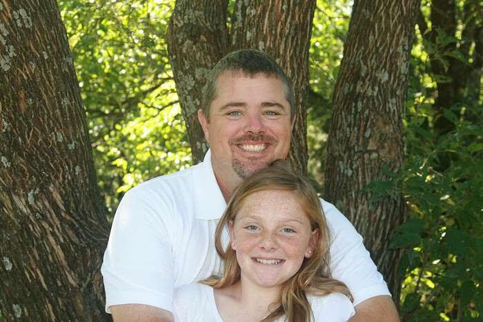 Olivia Kerr and her father. Kerr is a PE teacher and the Football coach for Baldwin High School. 