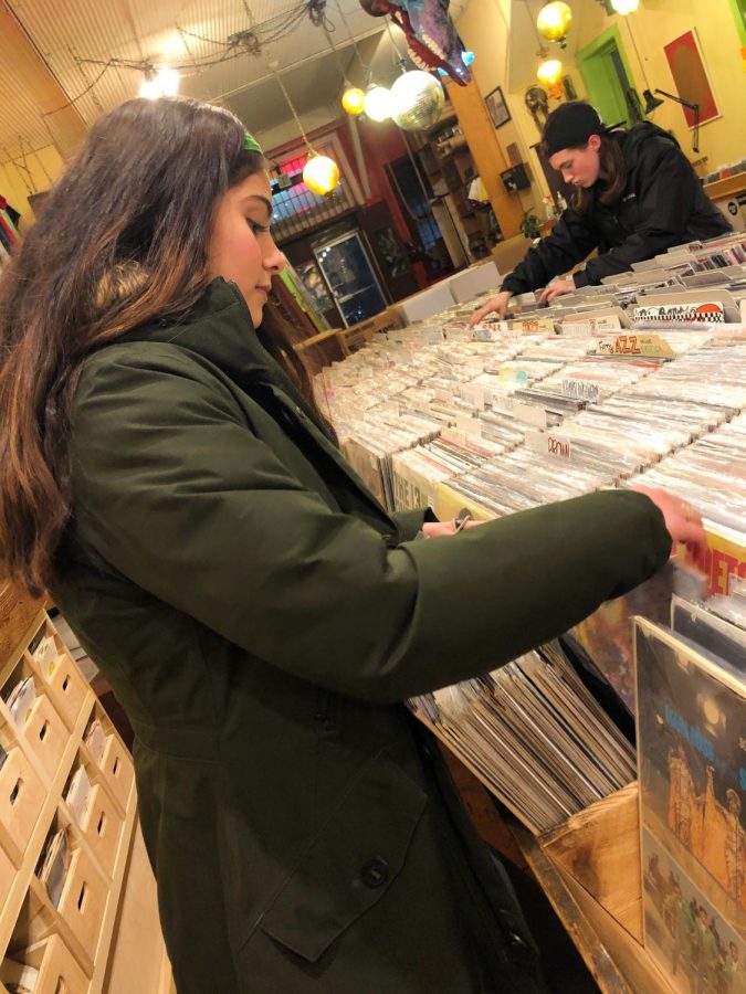 Victoria looks for records at Love Garden on Mass Street