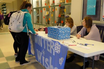 Winter Wishes being written down at lunch by Riley Galvan and Brooklyn Chase.