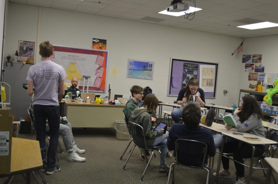 The cast members for the spring play pictured working together on parts. The members began working with Mr. Stephens about a month ago.