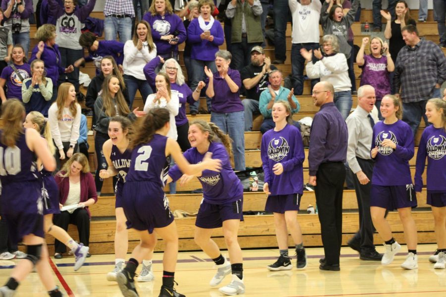 The Baldwin girls basketball team is celebrating their victory. They beat Nehama 47-46 to win the Top Gun Tournament.