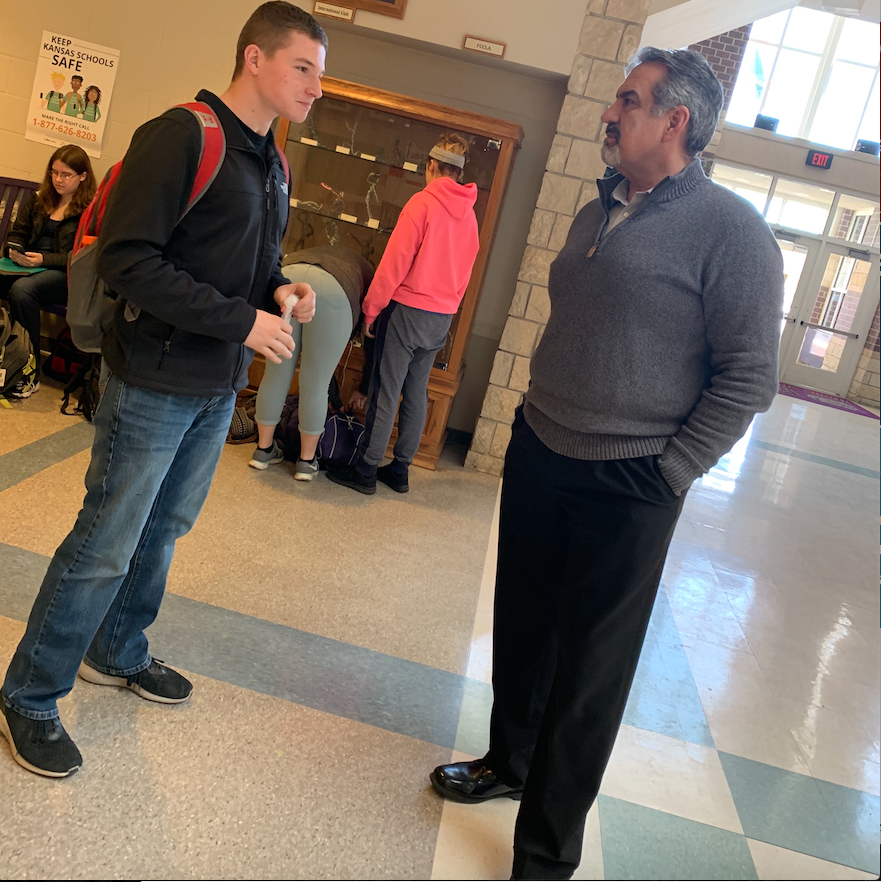 Frank Perbeck talking to sophomore student Shane Doty. Perbeck has been very busy since he has taken over as head principal.