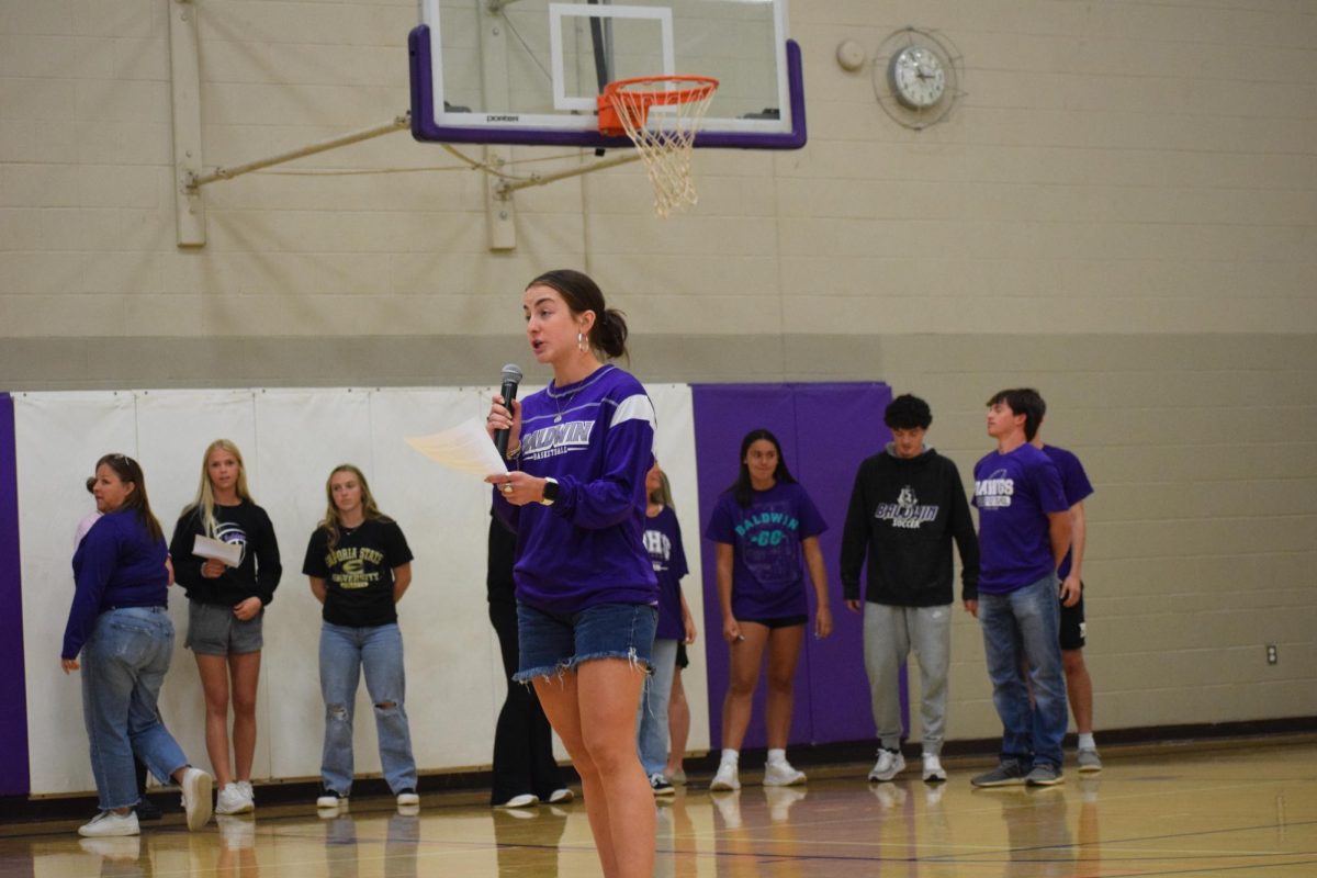 Bailey speaking to the school about prom.