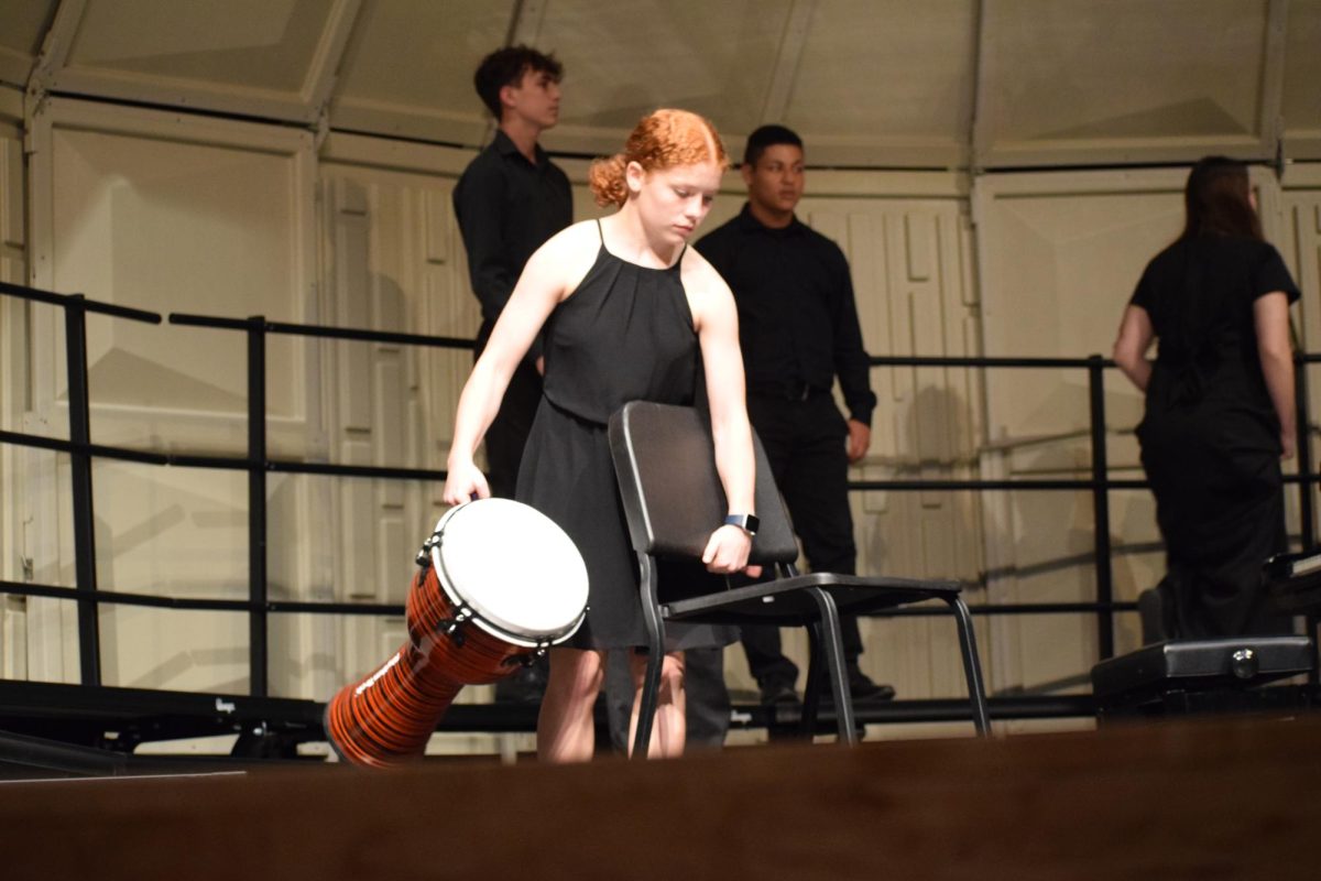 Taylor prepares to play percussion during the Choral Festival on April 4, 2024.